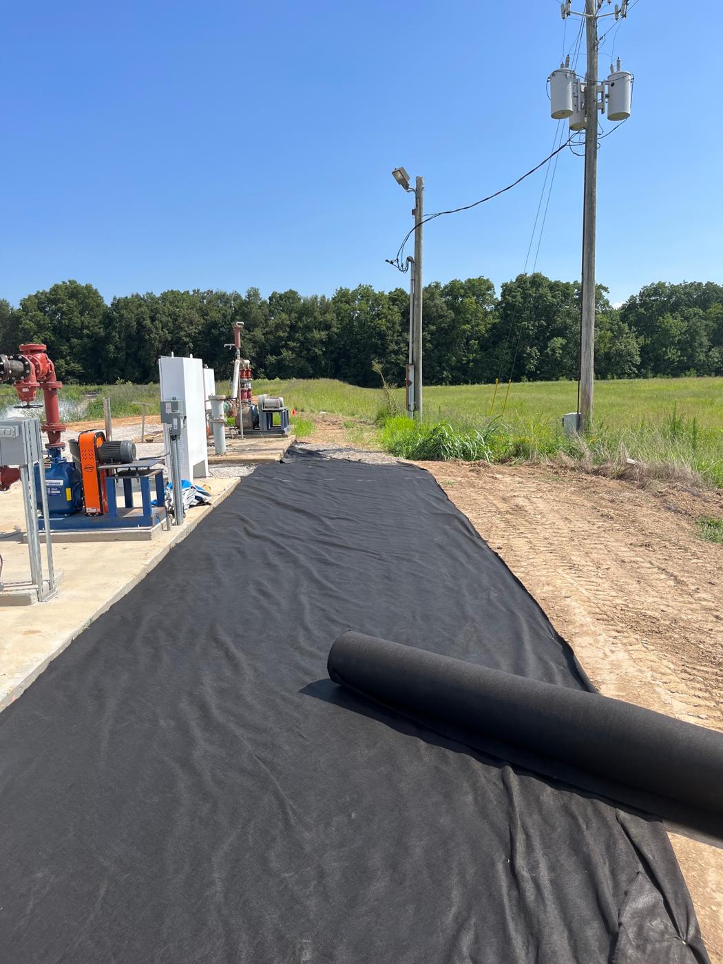 Fabric laid ahead of gravel and pad work