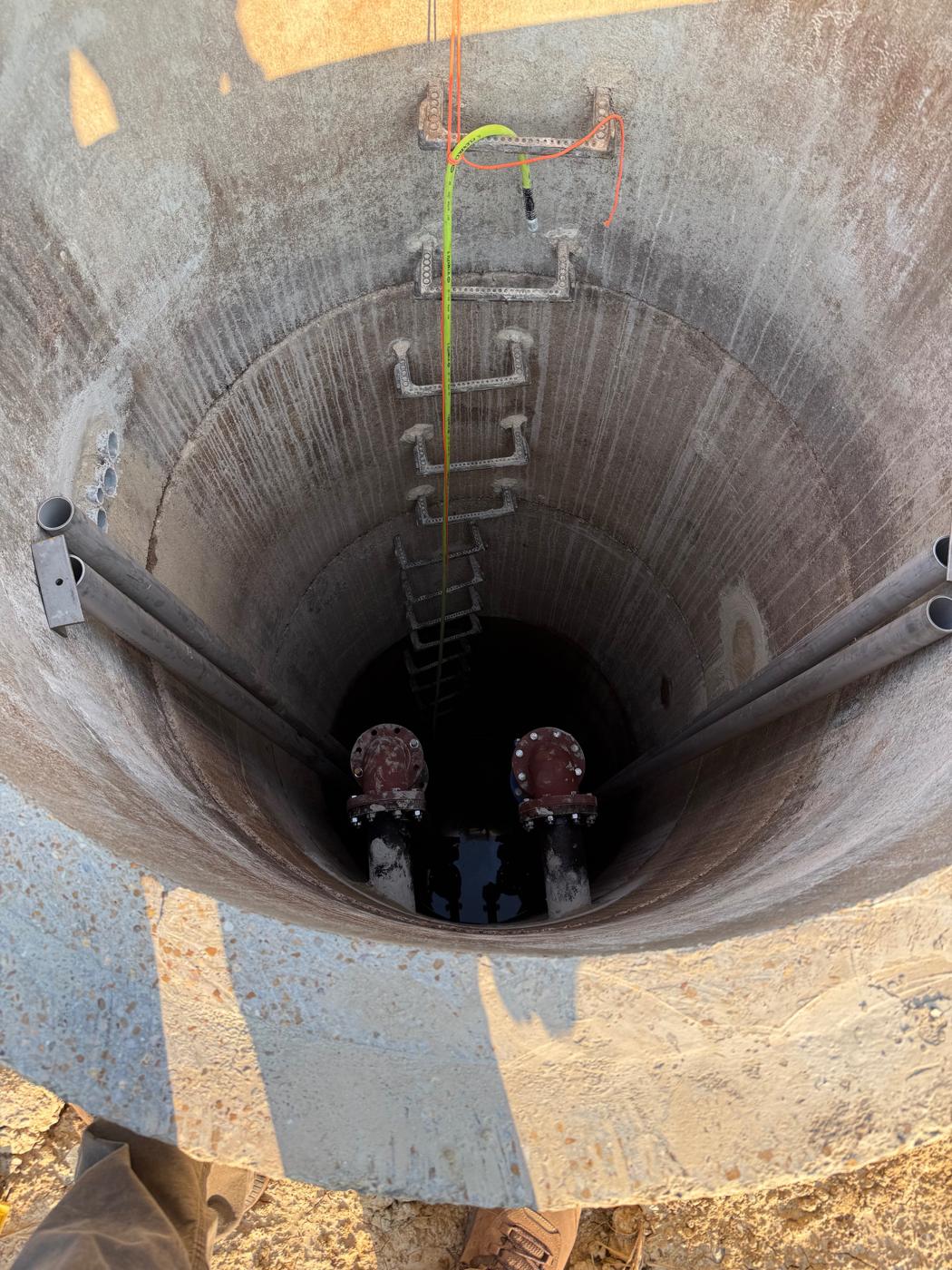 Inside the wet well: the new discharge piping and guide rails