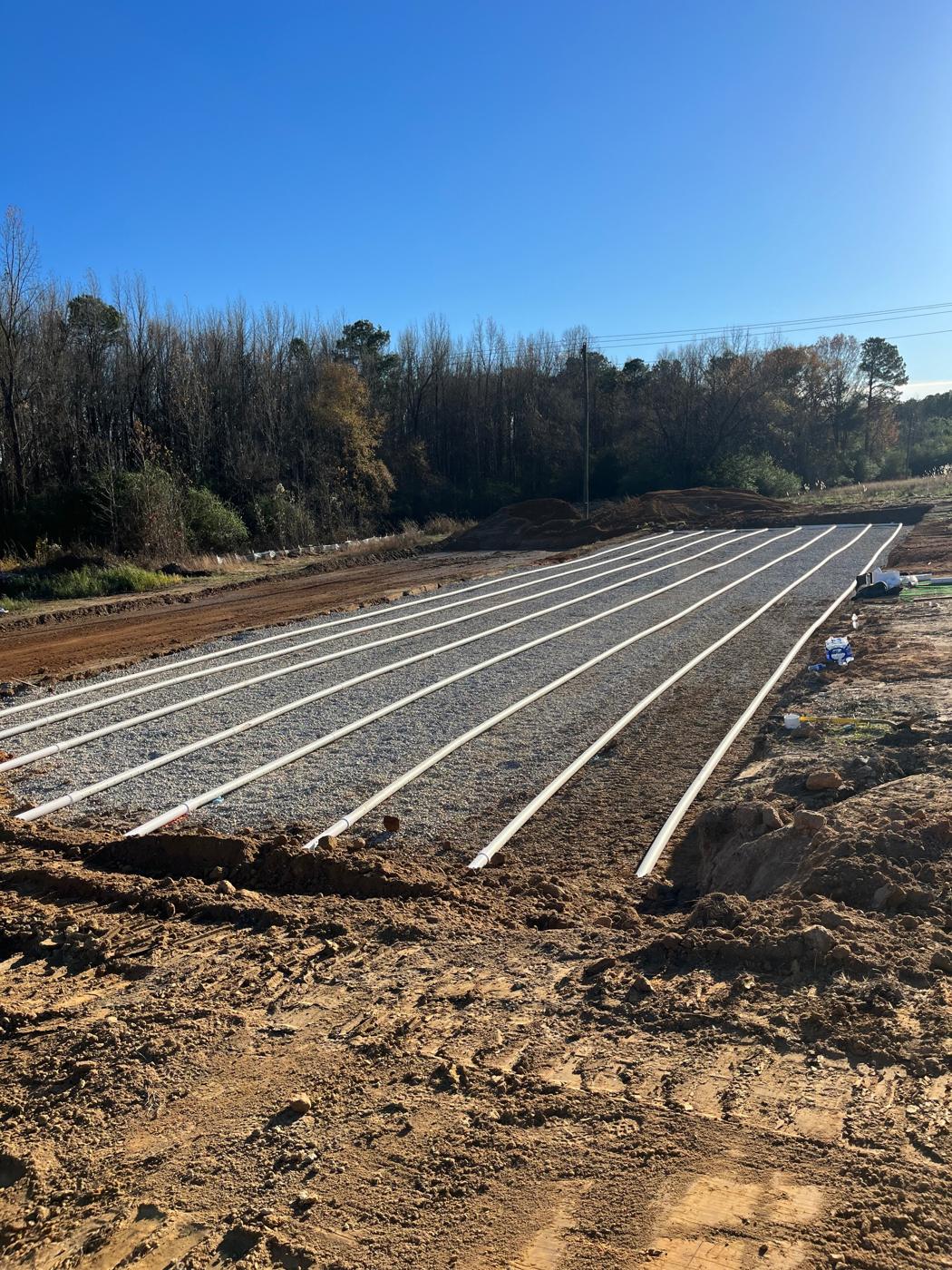 Lateral lines laid on gravel in an absorption bed