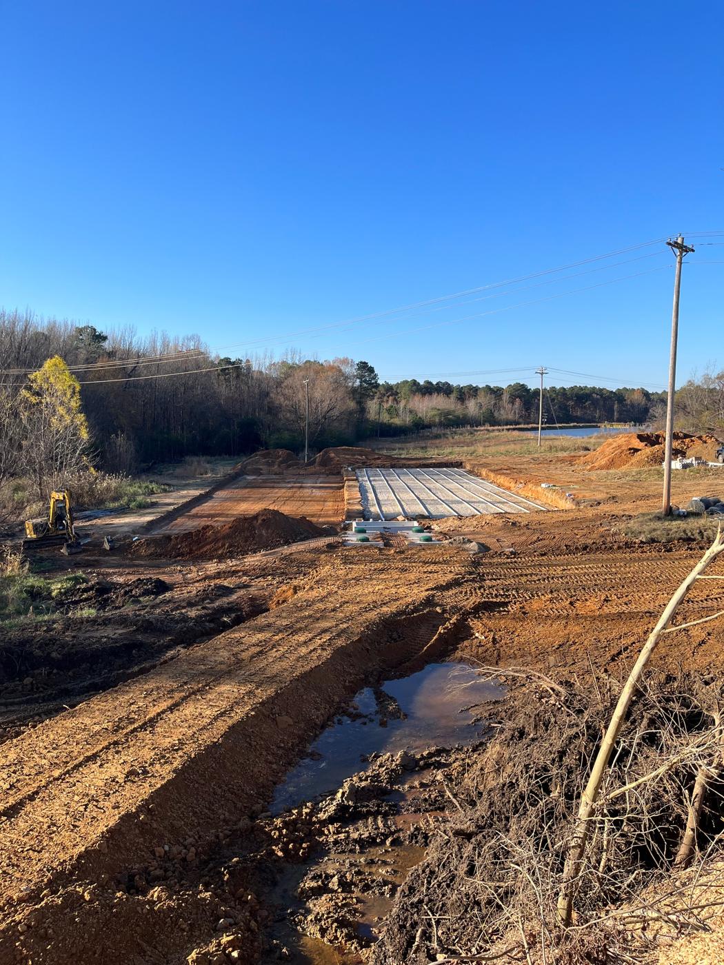 Site overview with the tanks, distribution box, and absorption beds